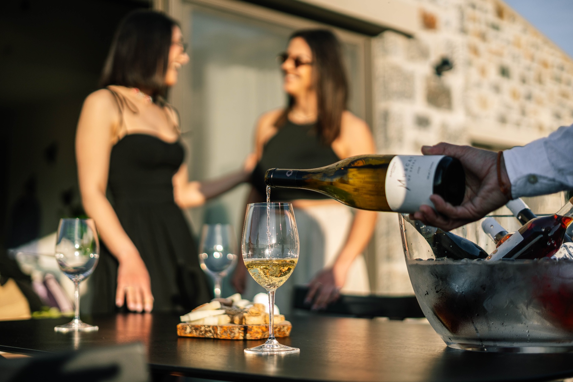 A bottle of Cretan wine being opened at a private tasting